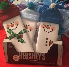 there are three snowmen wrapped in candy