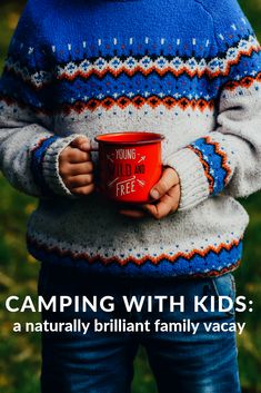 a person holding a red cup with the words camping with kids