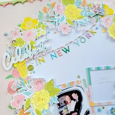 a scrapbook page with flowers and the words happy new york written in white letters