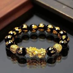 Size And Material: The Bracelet Features 12mm Diameter Beads Made Of Obsidian, And A Pi Xiu Charm Measuring Approximately 24.5mm X 12mm X 9mm, Crafted From Vietnamese Sand Gold. 2 Bracelets Product Features: Pi Xiu, Also Known As Pi Yao, Is An Auspicious Creature Symbolizing Luck And Wealth In Asian Culture. Obsidian Is Known For Its Ability To Ward Off Mental Attacks And Absorb Negative Energy From The Environment. Product Quality: This Feng Shui Black Obsidian Wealth Bracelet Is Crafted With V Black Obsidian Bracelet, Obsidian Jewelry, Obsidian Bracelet, Good Luck Bracelet, Obsidian Stone, Chakra Bracelet, Stone Bracelet, Bracelet Gift, Feng Shui