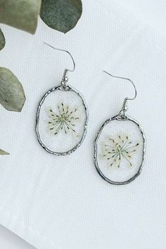 Delicate White Teardrop Flower Earrings, Silver Drop Earrings With Pressed Flowers, White Resin Pierced Earrings, White Resin Earrings For Summer, White Round Flower Earrings, White Round Flower Earrings, Pierced, White Round Pierced Flower Earrings, White Round Flower Earrings Pierced, Summer White Hypoallergenic Jewelry