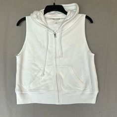 Hollister Zip Up Hoodie - New Without Tags!! Sleeveless Front Pockets Drawstring Hood Cotton Lined Hood Color: White Size: Xs Condition: New Without Tags!! Never Worn Or Washed. Sleeveless Hoodie, Hollister Tops, Hollister, Zip Ups, Sweatshirts Hoodie, Womens Tops, White, Women Shopping, Color