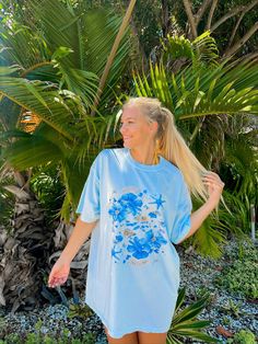 Beachy Oversized Comfort Colors T-Shirt with Blue Floral & Seashell Design - Tropical Summer Vibes, Comfortable Casual Cover-Up for Women Hi, welcome to CCAPPARELTX! If you are looking for trendy lifestyle apparel for your best moments in life, then you have come to the right place. You can find comfortable and casual clothing that you can CUSTOMIZE, for you and your loved ones. We hope you enjoy your time at our shop, the processing time is currently 1-5 days. If you would like to rush your ord Spring Vacation T-shirt With Crew Neck, Blue Short Sleeve Summer Tops, Blue Crew Neck Shirt For Vacation, Blue Short Sleeve Tops For Beach Season, Summer Short Sleeve Printed Tops, Cotton Short Sleeve Tops For Beach Season, Beachy Relaxed Fit Short Sleeve Shirt, Blue Crew Neck Tops For Beach Season, Beach Season Short Sleeve T-shirt For Day Out