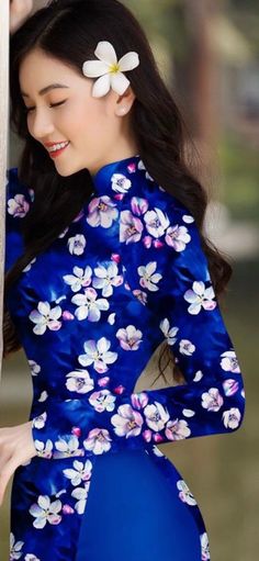 This high quality and very beautiful traditional Vietnamese ao dai that is suitable for all occasions.  It has a very beautiful floral prints that makes it look more elegant.  There is no return.  We offer free shipping.  Please feel free to contact us if you have any questions.   Asian Size Size: XL We also have size S to XL, please note we currently have size XL available in stock.  Any other sizes will be a back order ( minimum about 3 months to arrive in stock. ** Other size are available as well.  4XL and 5XL Fitted Ao Dai With Floral Print For Spring, Spring Wedding Ao Dai With Floral Print, Summer Fitted Blue Ao Dai, Traditional Fitted Blue Ao Dai, Traditional Ao Dai With Floral Print And Long Sleeves, Traditional Blue Fitted Ao Dai, Traditional Ao Dai With Floral Print, Blue Fitted Long Sleeve Ao Dai, Traditional Long Sleeve Ao Dai With Floral Print