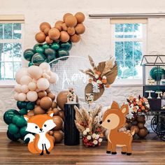 an animal themed party with balloons and decorations