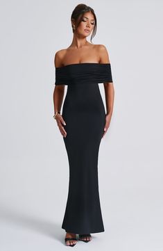 Whether itÃ¢â‚¬â„¢s date night or girlsÃ¢â‚¬â„¢ night, capture all attention in the Belinda maxi dress. Made in super smooth, slinky fabric that moulds to your body, this double layered design features an off the shoulder, bardot neckline that's gathered. It's complete with an open low back with ruched detailing. Looks amazing paired with tonal heels and gold jewellery. 



Colour: Black.

Stretch double layered slinky fabric.

Fully lined.

Gathered, bardot neckline.

Hugs the figure.

Super sc Dirndl Outfit, Backless Gown, Bandeau Tops, Rock Outfit, Maxi Dress Sale, Sleeveless Long Dress, Bodycon Maxi Dresses, Sparkle Dress, Mini Robes