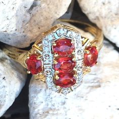 Natural Rubies Totaling >1.2cts Are Set In This Lovely 9k Yellow Gold Cluster Ring (Size 9) Imported From The Uk. Natural Zircon (Not Cz!) Accents. This Is An Extremely Limited Edition Item, Only 25 Were Sold! The Genuine Ethically Sourced Gemstones Were Heated But The Rubies Have Not Been Fissure-Filled. These Tanzanian Rubies Have A More True Red Color Than The Pinkish Red Often Seen In Rubies Set In Jewelry. Shop With Confidence, I'm A Certified Gemologist! Ruby Ring With Baguette Cut For Anniversary, Anniversary Ruby Ring With Baguette Cut, Red Diamond Cluster Ring With Vvs Clarity, Classic Ruby Ring With Diamond Accents In Cluster Shape, Classic Ruby Ring With Diamond Accents Cluster, Classic Red Cluster Diamond Ring, Red Cluster Jewelry With Diamond Accents, Dazzling Ruby Ring With Accent Stones For Anniversary, Red Baguette Cut Diamond Accent Rings