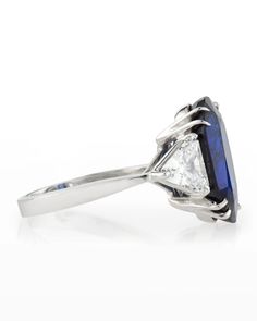 Fantasia by DeSerio ring. 14karat white gold. 9.00 carat oval synthetic sapphire. Trillioncut cubic zirconia sides. 10.00 total carat weight. Slim band. Made in the USA. Cubic Zirconia Rings, Neiman Marcus, Top Designers, Cubic Zirconia, Jewelry Collection, Made In The Usa, Tops Designs, Sapphire, White Gold