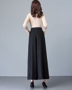 * A simple wide leg pants for winter, made of quality wool blends. * Two pockets, they are big enough for Iphone and your hands. * Fixed waist with zipper and button. * Material: 50% wool, 50% polyester; lining-100% polyester * Washing instructions: Dry Clean Only * Let us know your usual size in your country and your overall height. * Can custom make waist size and length. * Size: True to US size, US 0-US 20 are available, you can let us know your usual size and height in your order. * Shipping Winter Solid Full-length Bottoms, Black Wide-leg Dress Pants With Loosely Fitted Hips, Black Ankle-length Dress Pants For Winter, Black Loose Fit Ankle-length Dress Pants, Elegant Baggy Dress Pants For Fall, Loosely Fitted Full-length Winter Pants, Black Wide Leg Dress Pants With Pockets, Winter Workwear Bottoms, Full-length Bottoms For Winter Workwear