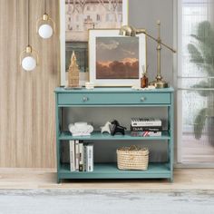 a blue shelf with books and pictures on it