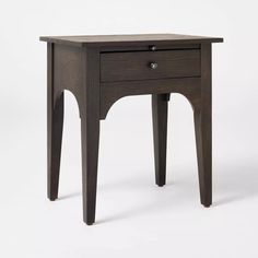 a small wooden table with one drawer on the top and two legs at the bottom