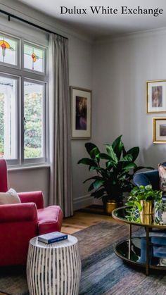 a living room filled with furniture and windows