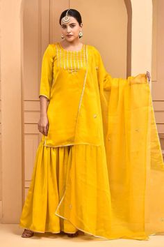 Yellow satin silk kurta with gota embroidery. Comes with sharara and an organza dupatta. - Aza Fashions Semi-stitched Slub Silk Sets With Dori Work, Eid Palazzo Set With Dori Work In Traditional Drape, Traditional Drape Palazzo Set With Dori Work For Eid, Gold Slub Silk Palazzo Set With Dabka Work, Gold Palazzo Set With Dabka Work In Slub Silk, Sharara With Gota Work For Eid, Traditional Sharara With Gota Work For Eid, Traditional Chanderi Palazzo Set With Gota Work, Traditional Drape Chanderi Palazzo Set With Gota Work