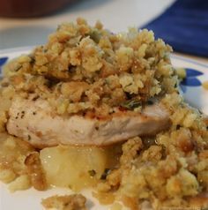 a white plate topped with meat covered in stuffing