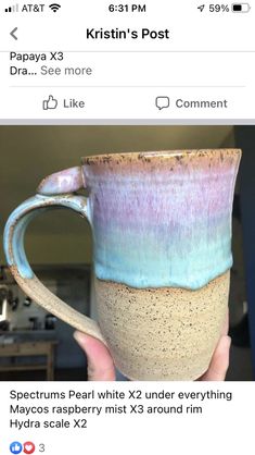 someone is holding up a coffee mug with blue and pink glaze on it,