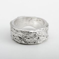 This "Fiji" silver ring is handmade in Fine Silver (99.9% pure silver). This unique piece is entirely molded by hand, using the silver clay technique. The style of this ring is inspired by the beauty of the most amazing coral reefs in the world. Ring size: 7.25 (This is a unique creation. Only one size available. I cannot adjust the ring size.) What is Fine Silver? Fine Silver, also called Precious Metal Clay or Silver Clay, is a malleable material composed of microscopic particles of pure silver. It is made from silver that is recycled from a range of sources, including waste from x-rays and the photographic industry. It can be worked like traditional clay using the hands, or else molded. The molded piece is then heated to merge the fine silver particles together. The result is a 99.9% pu Sterling Silver Carved Promise Ring, Nature-inspired Silver Ring Stamped 925, Unique Carved Sterling Silver Rings, Artisan White Gold Sterling Silver Rings, Artisan White Gold Rings In Sterling Silver, Unique Carved Silver Rings, Artisan Sterling Silver Rings In White Gold, Artisan Silver Rings With Carved Details, Carved Sterling Silver Rings For Anniversary