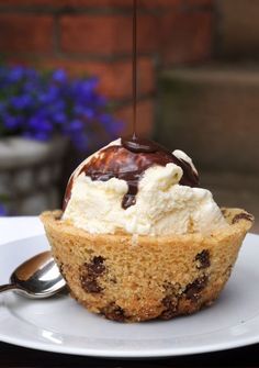 a chocolate chip cookie cupcake with ice cream on top