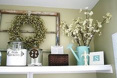 a shelf filled with vases and other items