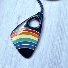 In honor of pride month and in solidarity with the Black Lives Matter movement, I have created my Rainbow Pride Pendant. The rainbow represents the highest spiritual ideals such as diversity, equality and hope. I hope that wearing or gifting this pendant allows you to shine these ideals out to others. The pendant is made with a copper base. I sift, pack and fire many layers of enamel along the fine silver wires to create the cloisonne piece. I then grind the glass so that the front is smooth. A Retro Rainbow Colored Jewelry Gift, Rainbow Retro Jewelry For Gift, Retro Rainbow Jewelry For Gifts, Retro Rainbow Jewelry Gift, Handmade Jewelry For Pride Gift, Pride Multicolor Jewelry Gift, Multicolor Jewelry For Pride Gift, Handmade Retro Rainbow Jewelry, Black Lives Matter Movement