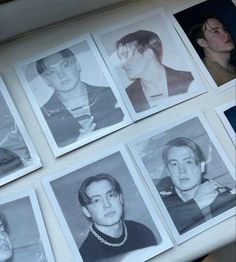 black and white photographs of young men with necklaces on their necklines, hanging from a wall