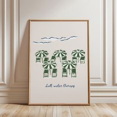 an art print with beach chairs and umbrellas on the wall next to a wooden floor