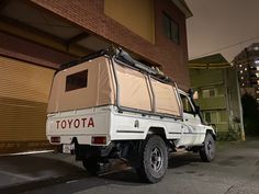 an off road vehicle parked in front of a building