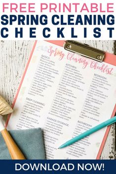 a printable spring cleaning checklist on a clipboard next to a brush and paper