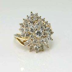 14K Yellow Gold 3ct Diamond Domed Cocktail Ring, H color - VS/SI clarity, 4.25mm center rounds to one side, marquise to other half almost pear shaped top, on bypass band split shank open wire work support, 7/8 inch across, 1/2 inch above finger, 5 tiers, 31 round diamonds, 11 marquise diamonds, Ring size 7.25, Circa 1960, 6.9 grams SKU# BB286R25 This listing contains photographs of the actual item you will receive. Our items are in excellent condition with little or no signs of wear and many are White Marquise Diamond Ring With 17 Jewels, Diamond White Pear-shaped Cluster Ring For Formal Occasions, Formal Diamond White Pear-shaped Cluster Ring, Formal Pear-shaped Cluster Ring In Diamond White, Formal Pear-shaped Diamond White Cluster Ring, Pear-shaped Diamond Cut Cluster Ring For Anniversary, Pear-shaped Brilliant Cut Cluster Ring For Anniversary, Classic Marquise Cluster Ring For Anniversary, Formal Marquise Cluster Ring With Vvs Clarity