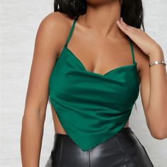 Sexy And Elegant, This Satin Bandana Top Features A Cowl Halter Neckline Which Leads To A Self-Tie Back, A Front Asymmetrical Hem, And An Open Back Design. It Is 97% Polyester And 3% Elastane. It Is A Size Xs Fitting Women (0-2). It Has Never Been Worn And Is In Brand New Condition. Bundle To Save. Fitted Satin Halter Top For Date Night, Stretch Satin Crop Top For Night Out, Chic Satin Tops For Club, Elegant Fitted Green Halter Top, Elegant Cami Crop Top For Club, Stretch Satin Halter Top For Party, Elegant Camisole Tops For Club, Party Satin Tops With Built-in Bra, Satin Party Tops With Built-in Bra