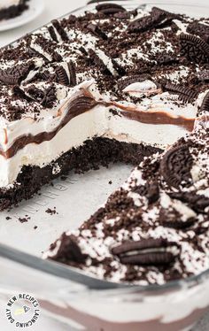 an oreo cookie cake with white frosting and chocolate chips