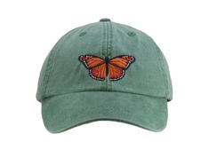 Monarch Butterfly embroidered on a pigment dyed cap in choice of color. Shown on forest Colors may not look the same on all monitors Adams brand 100% garment-washed cotton twill 6-panel, unstructured, low-profile tuck-away back leather strap with antiqued brass buckle and grommet adjustable. fits men or women Cool-Crown™ mesh lining four rows of stitching on bill Garment washed, pigment dyed gives the cap a nice faded look Spring Outdoor Snapback Dad Hat, Vintage Baseball Cap With Curved Visor For Spring, Snapback Dad Hat For Outdoor Use In Spring, Vintage Dad Hat With Curved Bill For Spring, Green Baseball Cap For Spring Outdoor Activities, Green Baseball Cap For Outdoor Spring Activities, Green Dad Hat For Outdoor Spring Activities, Spring Outdoor Dad Hat With Curved Brim, Spring Outdoor Dad Hat With Visor