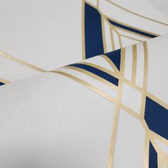 an image of a white and blue wallpaper with gold lines on the side,