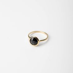 Natural black onyx 14K solid gold ring for women. A delicate black onyx gemstone ring, ideal for stacking for every woman who loves elegance. An excellent choice for an anniversary gift or a Christmas gift for her by Kyklos. 100% handcrafted with love! D E T A I L S ● Metal: 14K solid gold, 14K white gold or 14K rose gold ● Gemstone: Black Onyx, briolette cut ● Stone Diameter: 8mm (0.31in), 10mm (0.4in) and 12mm (0.5in)  R I N G ∙ S I Z I N G For General Reference: ● we use standard US Ring Sizing ● an average women's ring finger is size 6-7 ● each ring is custom made upon order, in any desired size. ● if your ring size is not listed please contact us H O W ∙ T O ∙ O R D E R Choose from the drop down menus the available options (MetalColor-StoneSize, Ring Size) and leave us a note for any Fine Jewelry Yellow Gold Onyx Rings, Fine Jewelry Yellow Gold Rings With Onyx, Elegant Stackable Black Rings, Minimalist Onyx Ring For Formal Occasions, Minimalist Onyx Rings For Formal Occasions, Elegant Yellow Gold Rings With Black Spinel, Elegant Yellow Gold Ring With Black Spinel, Minimalist Onyx Gemstone Ring, Timeless Black Stackable Jewelry