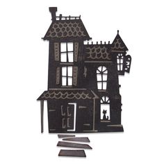 a wooden cutout of a house with windows