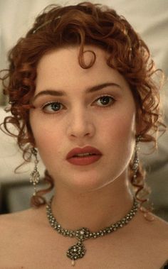 an image of a woman with red hair and jewelry on her neck, next to a photo of a woman in black dress