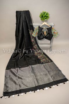 Elevate your summer wardrobe with our Black Linen Embroidered Saree with Grey pallu, And Blouse. Made from soft, breathable fabric, this saree boasts delicate floral embroidery on one side for a touch of sophistication. Paired with a matching blouse, this stylish ensemble is perfect for those who appreciate the luxury of lightweight linens. Fancy Clutch, Kids Wear Boys, Pleated Saree, Saree And Blouse, Kids Wear Girls, Silk Saree Banarasi, Block Print Saree, Fancy Gowns, Silk Thread Bangles