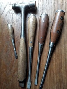 five different types of wood shaving tools on a table