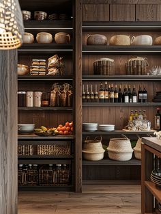 a kitchen with wooden shelves filled with lots of dishes and baskets on top of them