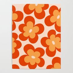 an orange and white flower pattern on a piece of paper