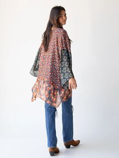 Throw-on-and-Go with the Sierra Kimono! The mixed print patterns and earthy tones flow as beautifully as the kimono itself! Throw it on with jeans and your favorite layering tee. This cute kimono will be the one you reach for again and again! Fall Vacation Tops With Bell Sleeves, Fall Vacation Bell Sleeve Tops, Bell Sleeve Tops For Fall Vacation, Fall Vacation Tunic With Relaxed Fit, Fall Vacation Rayon Kimono, Fall Vacation Cotton Tunic, Casual Floral Patchwork Blouse For Fall, Rayon Kimono For Fall Vacation, Oversized Casual Floral Print Blouse