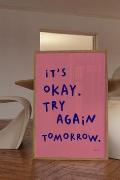 there is a pink poster with the words it's okay, try again tomorrow