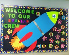 a bulletin board with an image of a rocket ship and the words welcome to our stellar crew