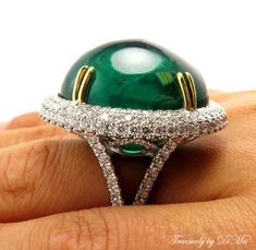 Elegant Cabochon Emerald Ring, Elegant Emerald Cabochon Ring, Elegant Emerald Ring With Cabochon Cut, Luxury Cabochon Emerald Ring For Wedding, Elegant Cabochon Emerald Ring For Formal Occasions, Elegant Domed Emerald Ring, Luxury Emerald Cabochon Ring For Wedding, Formal Emerald Cabochon Diamond Ring, Luxury White Gold Oval Cabochon Emerald Ring