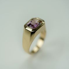 This 5.7 ct octagon ametrine has a beautiful cut that lets the purple and yellow shine. The gemstone is set in 14K yellow gold, in a very modern ring with straight lines. A mix of a signet and a solitaire ring. One of a kind ring DETAILS: 5.7 ct ametrine, octagon cut, 10x12mm 14K yellow gold Size: 6 3/4 Rectangular Amethyst Ring In Yellow Gold, Classic Yellow Gold Rectangular Amethyst Ring, Yellow Gold Amethyst Ring With Rectangular Shape, 14k Yellow Gold Emerald-cut Amethyst Ring, Rectangular Amethyst Rings In Yellow Gold, Gold Rectangular Amethyst Ring For Formal Occasions, Classic Amethyst Ring With Rectangular Stone For Formal Occasions, 14k Yellow Gold Amethyst Ring, Emerald Cut, 14k Yellow Gold Emerald Cut Amethyst Ring