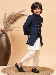 VASTRAMAY Boy's Navy Blue Indo Western Jacket With Cream Kurta And Pyjama Set Transform your little one into a trendsetter with the VASTRAMAY Boy's Navy Blue Indo Western Jacket paired elegantly with a Cream Kurta and Pyjama Set. This ensemble blends traditional charm with modern flair, ensuring comfort and style for festive occasions and celebrations. Features Includes a navy blue Indo Western jacket Comes with a cream kurta and matching pyjama Perfect for formal events and cultural festivities Western Jacket, Boys Wear, Matching Pajamas, Indo Western, Pyjama Set, Trend Setter, Formal Event, Little One, Pajama Set