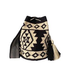 a black and white bag with tassels on the front, sitting against a white background