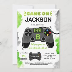 a video game birthday party card with a controller on the front and green watercolor paint