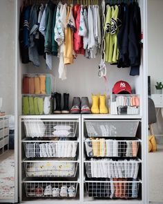 an organized closet with clothes and shoes