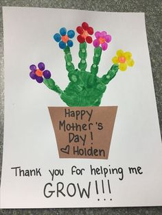 a child's handprinted flower pot with flowers on it and the words, happy mother's day 4 holiden thank you for helping me grow