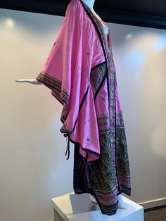 For Sale on 1stDibs - Torso Creations Pink Purple & Green Silk Caftan W/ Open Back, Embroidery, Purple Velvet Ribbon and Sequin Trim. Fashioned from vintage sari fabric in the Pink Silk Kaftan With Zari Work, Traditional Pink Kaftan With Traditional Drape, Pink Embroidered Traditional Kaftan, Pink Silk Kaftan For Festivals, Traditional Silk Kaftan For Eid, Festival Silk Kaftan With Traditional Drape, Bollywood Style Embroidered Kaftan, Traditional Silk Floor-length Kaftan, Bollywood Style Festival Kaftan With Traditional Drape